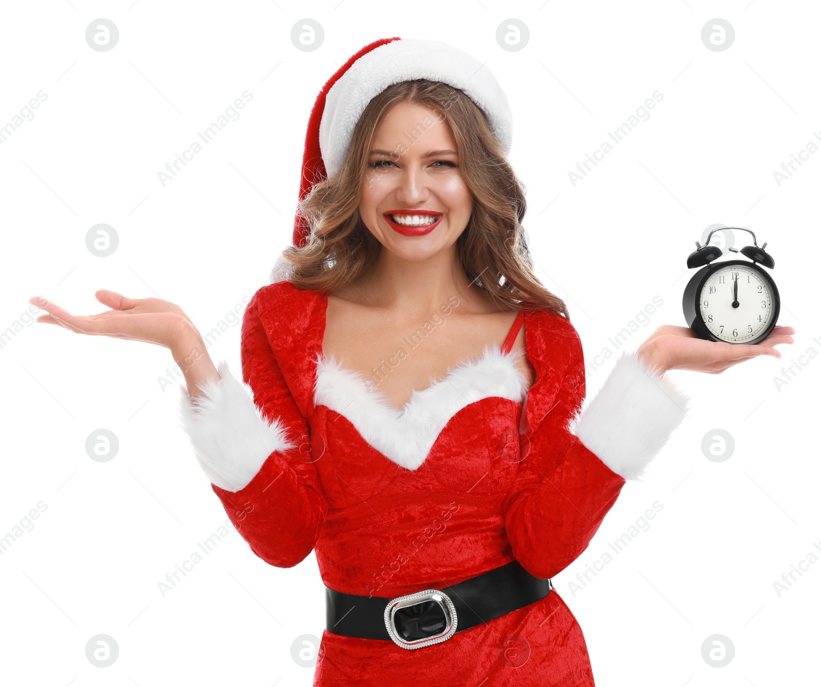 Photo of Beautiful Santa girl with alarm clock on white background. Christmas celebration