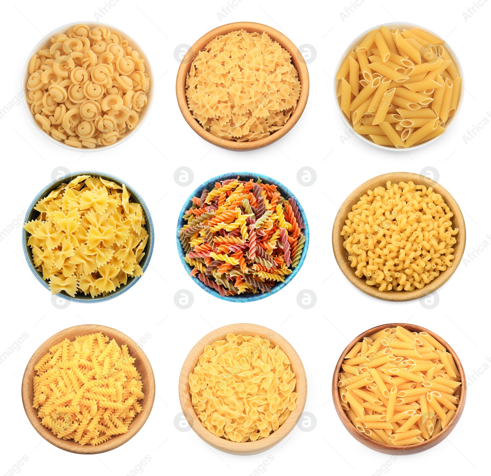 Image of Different types of pasta in bowls isolated on white, top view