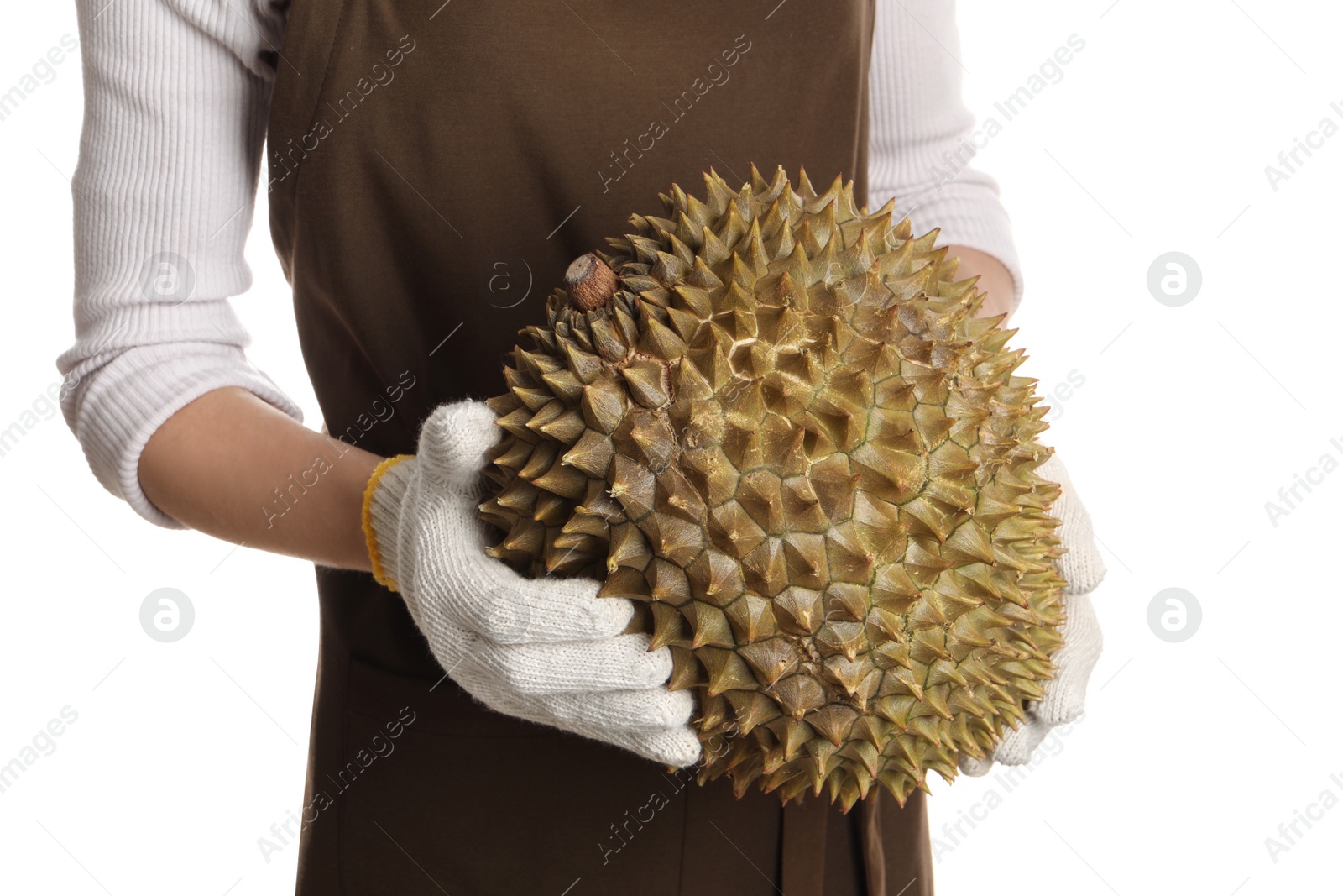 Photo of Woman in gloves holding fresh ripe durian on white background, closeup