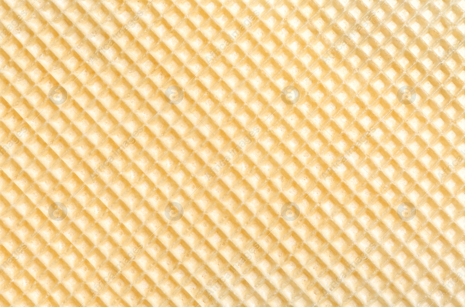 Photo of Tasty wafer as background, closeup. Crispy food