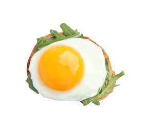 Photo of Slice of bread with fried egg and arugula on white background, top view