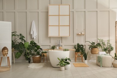 Stylish bathroom interior with green plants. Home design
