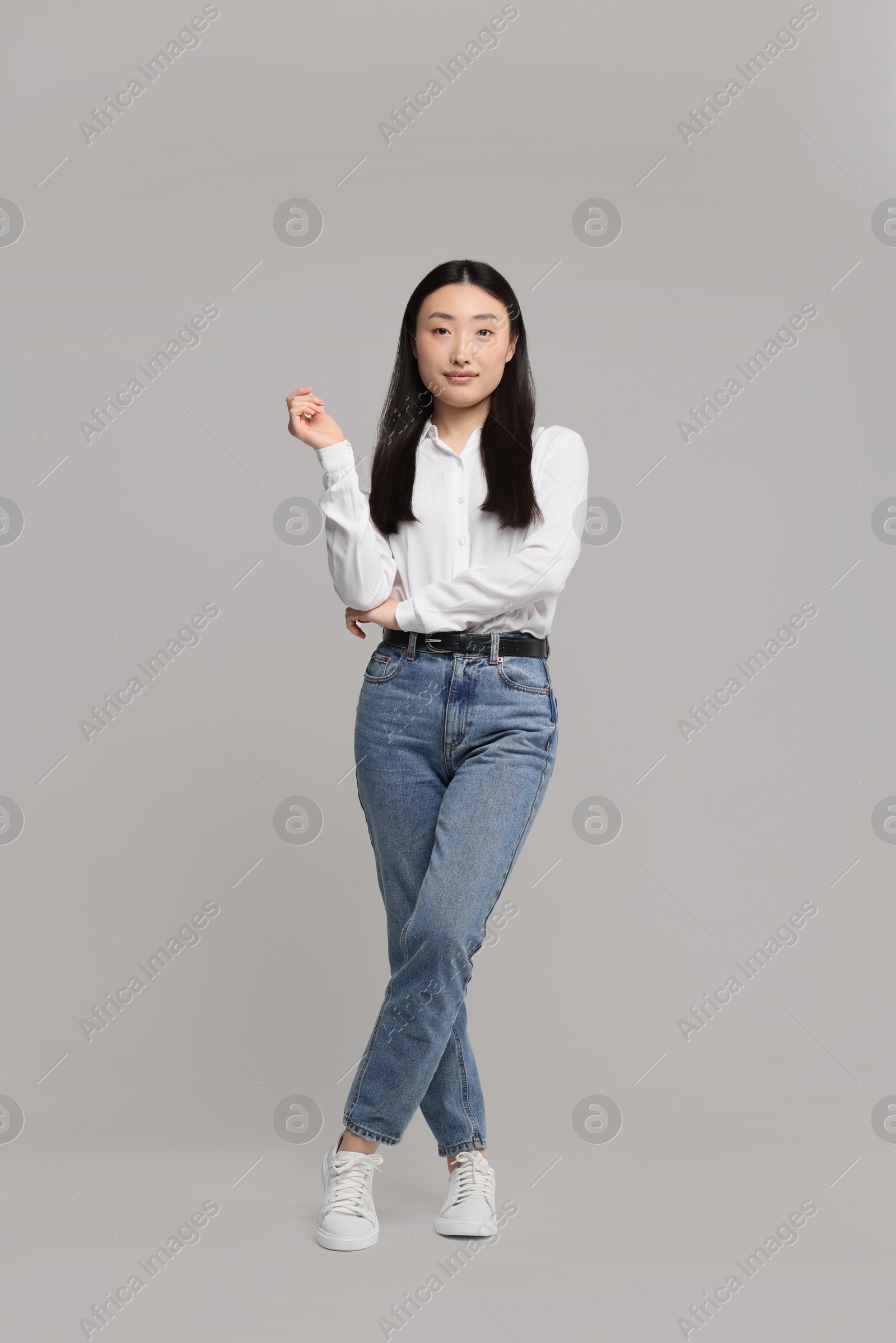 Photo of Full length portrait of beautiful woman on light background