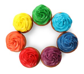 Photo of Different delicious colorful cupcakes on white background, top view