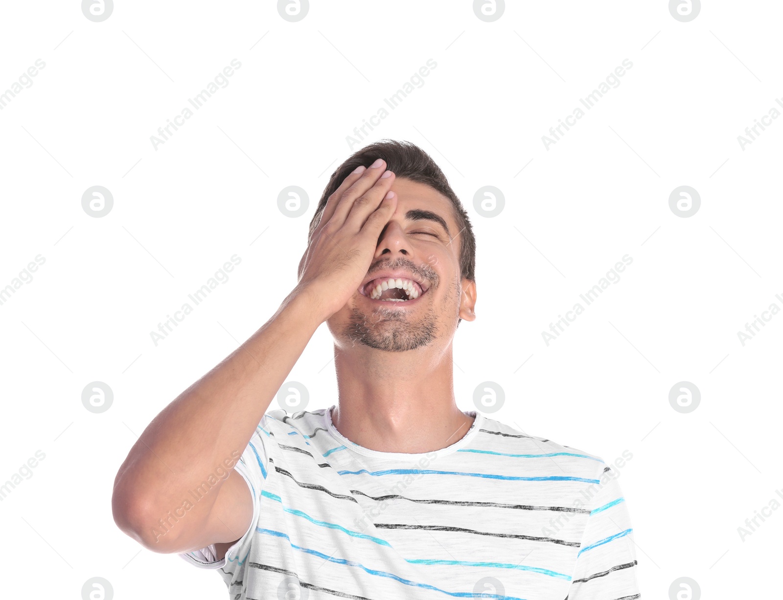 Photo of Portrait of handsome young man laughing on white background