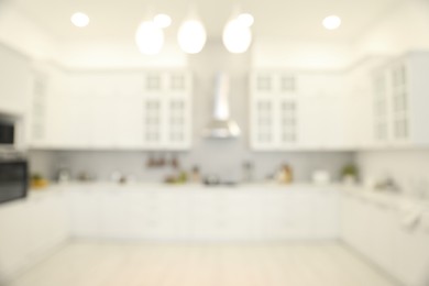 Photo of Blurred view of modern kitchen. Interior design