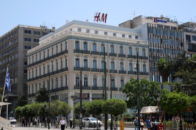 Athens, Greece - May 25, 2022: H&M fashion store logo on building outdoors