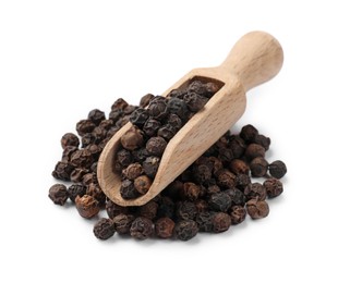 Photo of Aromatic spice. Many black peppercorns in scoop isolated on white