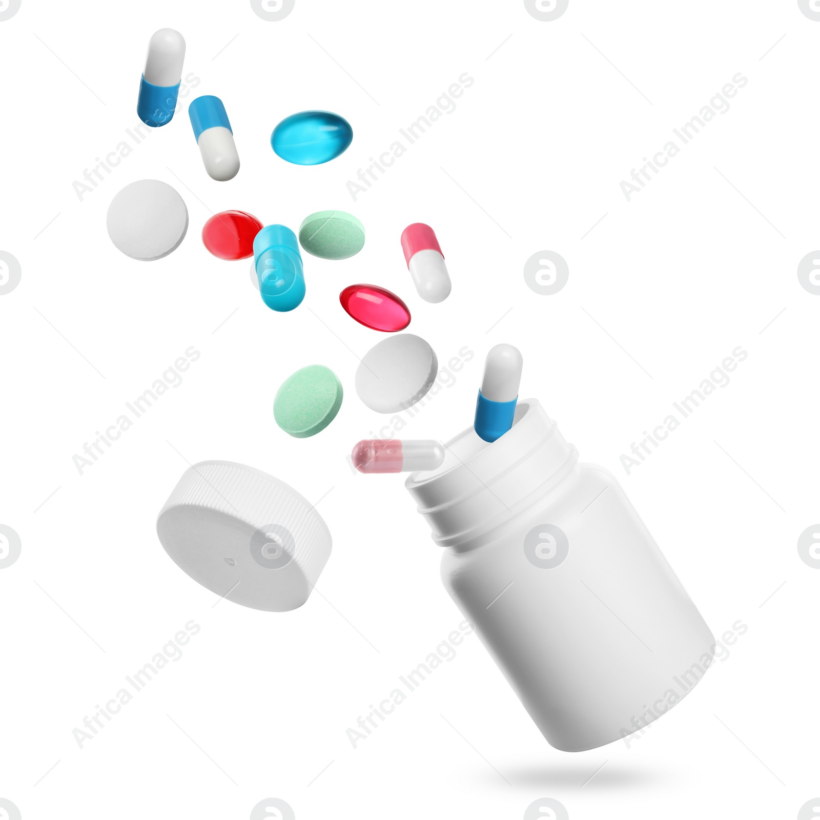 Image of Many different colorful pills falling into bottle on white background