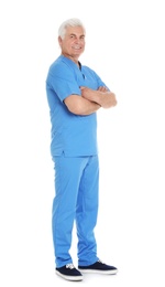 Photo of Full length portrait of male doctor in scrubs isolated on white. Medical staff