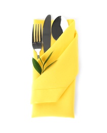 Photo of Folded napkin with fork, spoon and knife on white background, top view