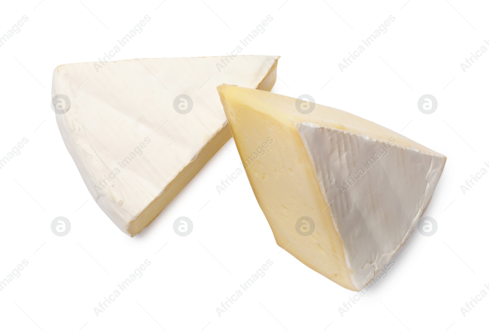 Photo of Pieces of tasty camembert cheese isolated on white, top view