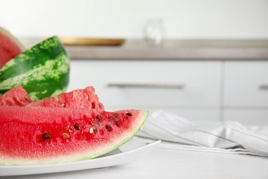 Photo of Yummy watermelon on white table in kitchen