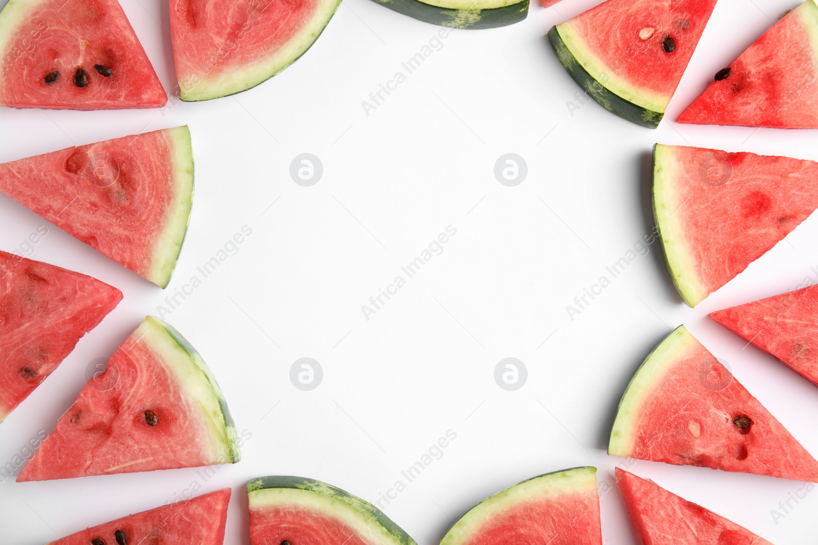 Photo of Frame made with slices of ripe watermelon on white background, flat lay. Space for text