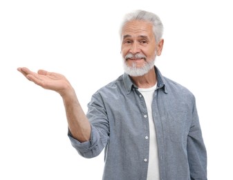 Special promotion. Smiling senior man holding something on white background