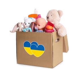 Image of Humanitarian aid for Ukrainian refugees. Donation box full of different toys isolated on white