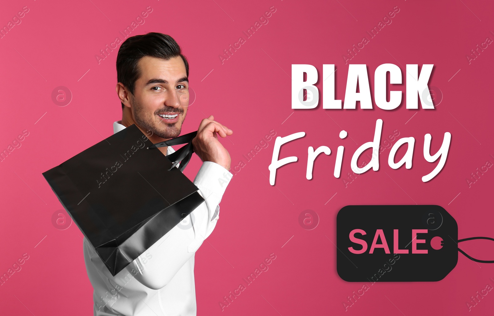 Image of Black Friday Sale. Young handsome man with shopping bag on pink background 
