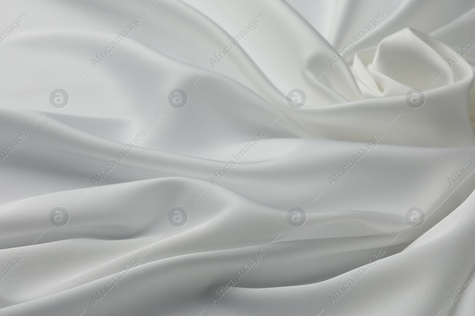 Photo of Texture of crumpled white silk fabric as background, closeup