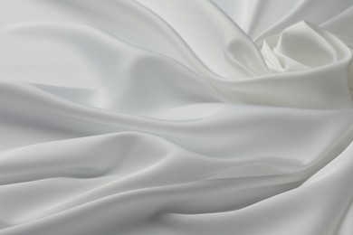 Photo of Texture of crumpled white silk fabric as background, closeup