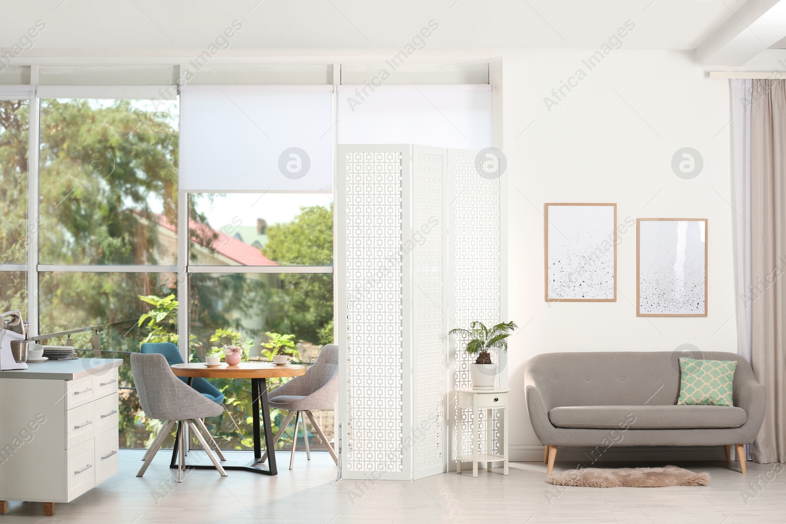 Photo of Modern folding screen in stylish room interior