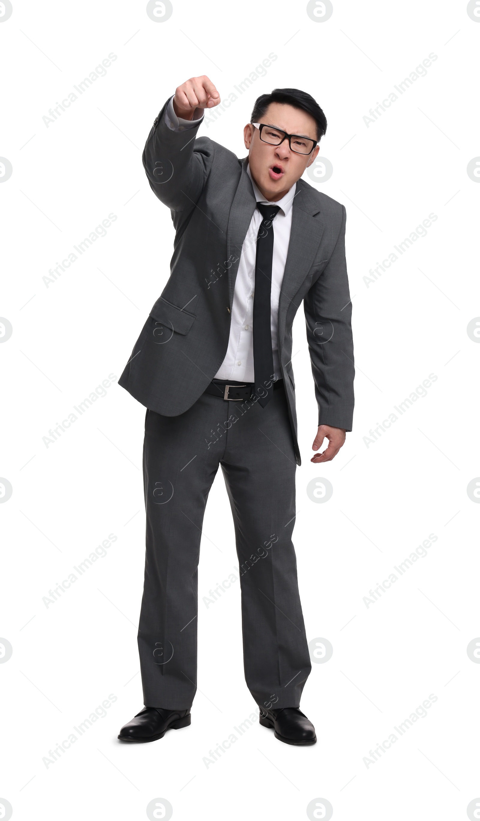 Photo of Angry businessman in suit screaming on white background