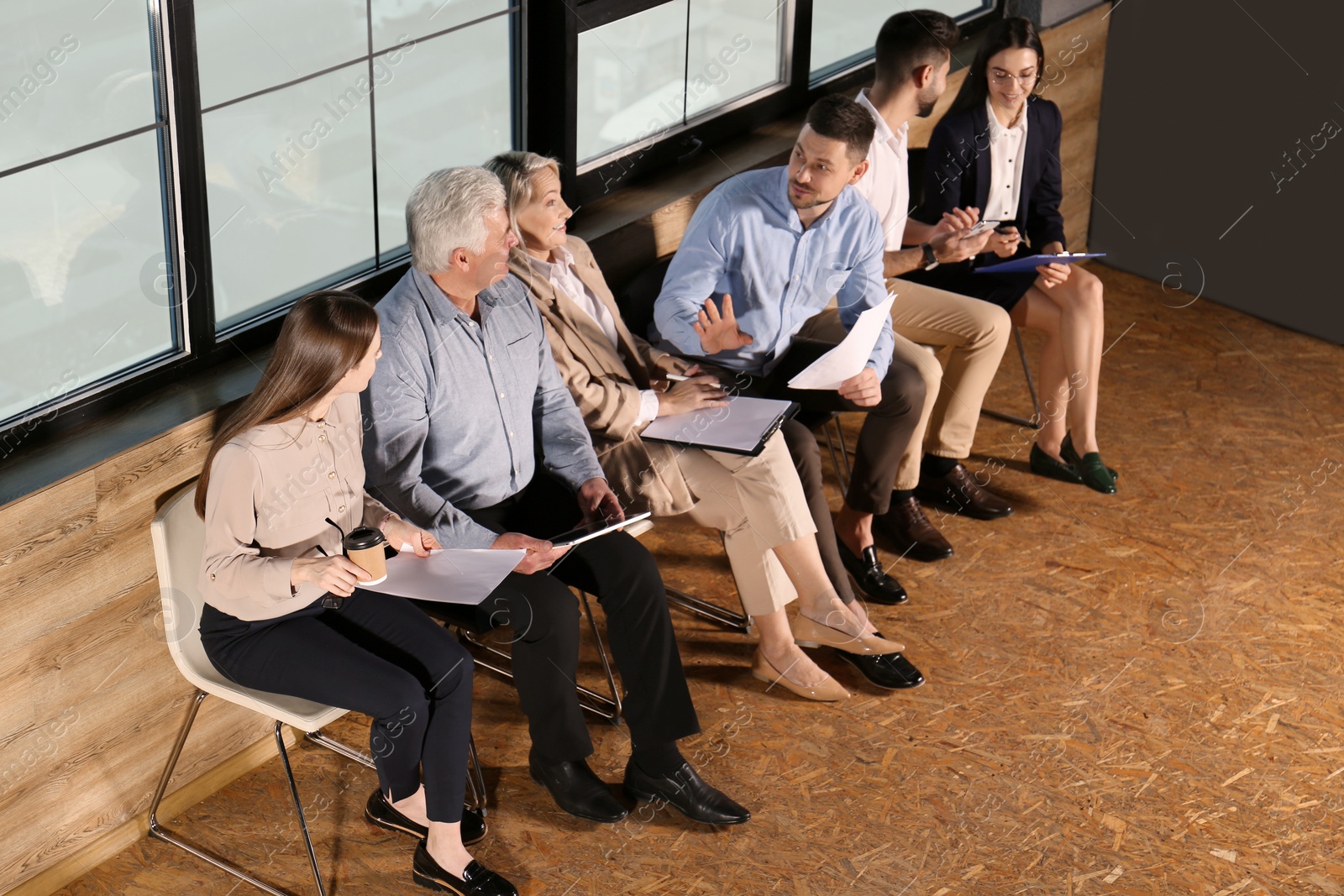 Photo of People waiting for job interview in office hall, above view