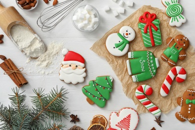 Photo of Flat lay composition with delicious homemade Christmas cookies on white wooden table