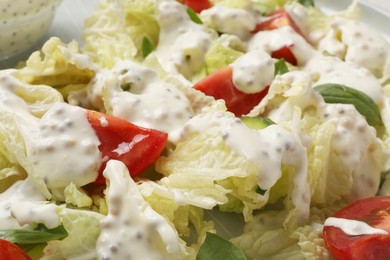 Delicious salad with Chinese cabbage, tomatoes, cucumber and dressing as background, closeup