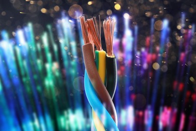 Image of Colorful electrical wires against blurred background, closeup. Bokeh effect