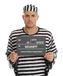 Photo of Mug shot of prisoner in striped uniform with board on white background, front view
