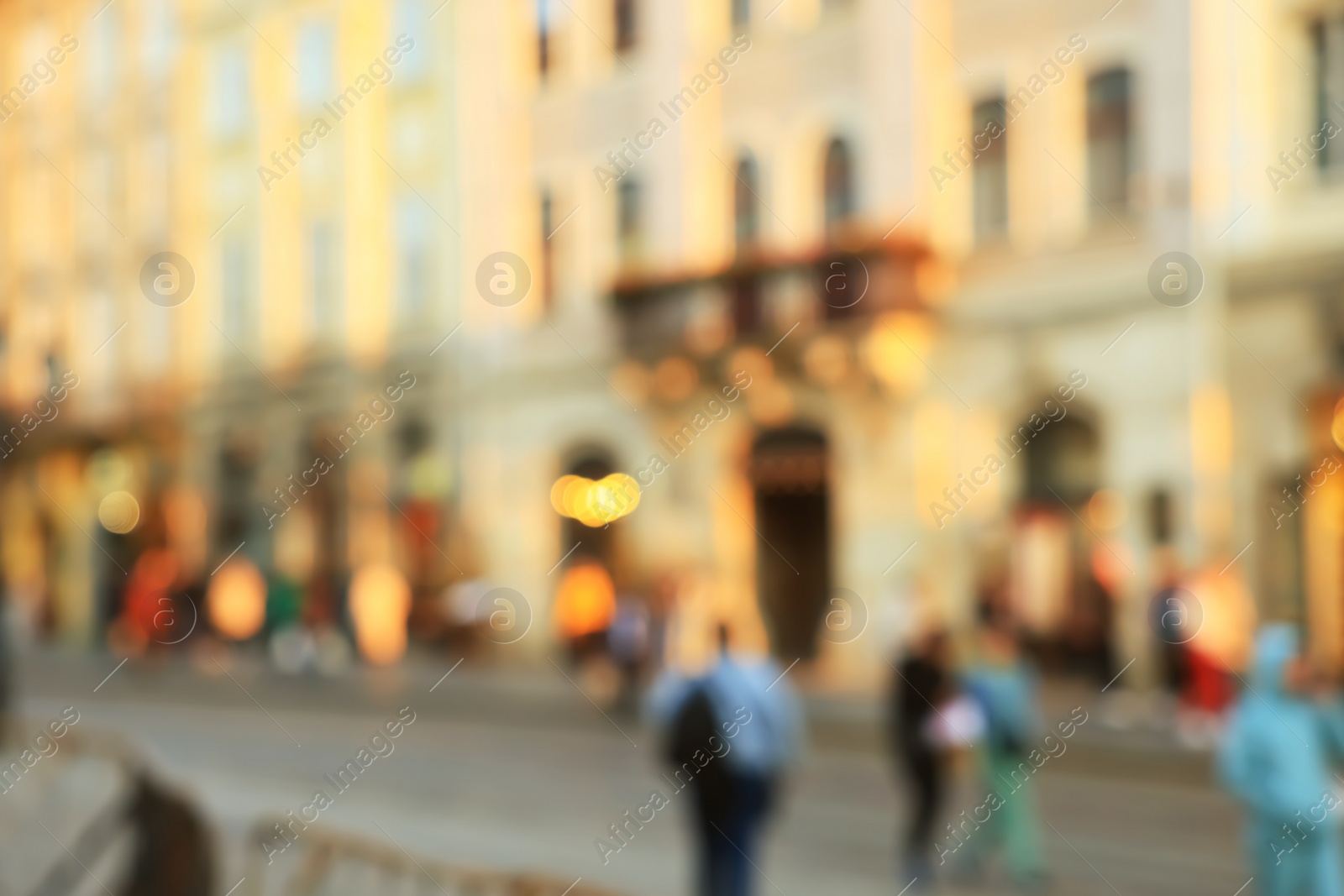 Photo of Blurred view of people walking on city street