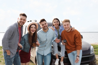 Group of happy people spending time together outdoors