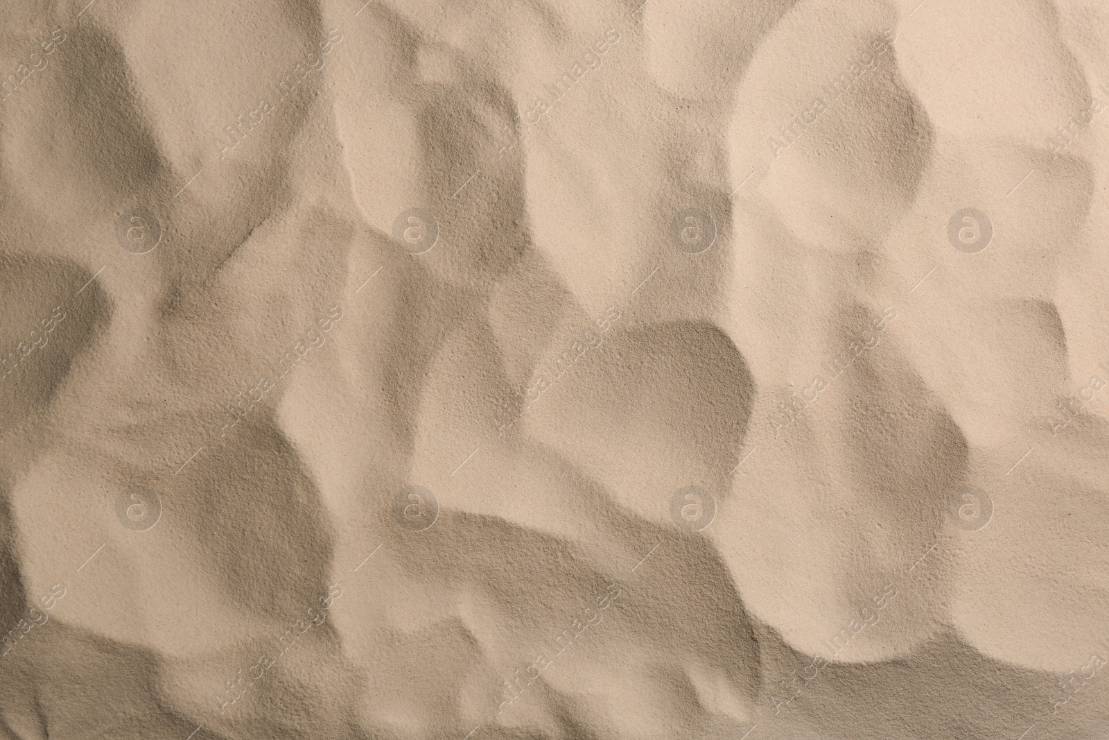 Photo of Dry beach sand as background, top view