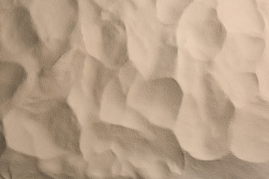 Photo of Dry beach sand as background, top view