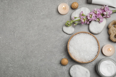 Flat lay composition with cosmetics on grey marble table, space for text. Spa treatment