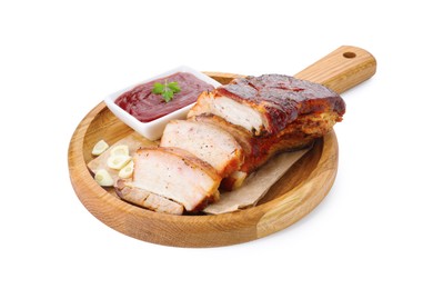 Photo of Pieces of tasty baked pork belly and sauce isolated on white