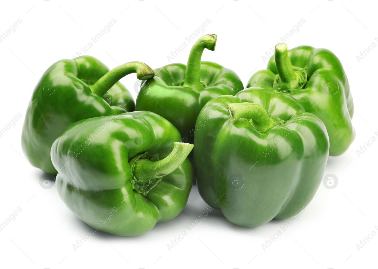 Photo of Pile of tasty green bell peppers on white background