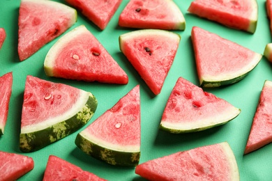 Photo of Slices of ripe watermelon on green background