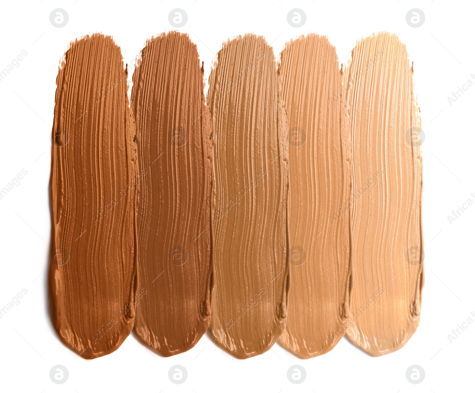 Image of Foundation of various shades for different skin tones isolated on white, top view. Set of samples