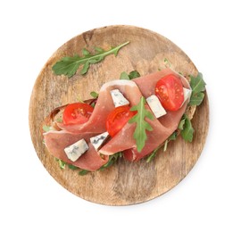 Photo of Tasty bruschetta with prosciutto, arugula, cheese and tomato on white background, top view