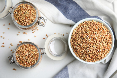 Photo of Flat lay composition with green buckwheat on white table