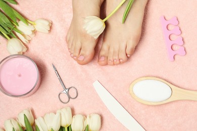 Photo of Closeup of woman with neat toenails after pedicure procedure on pink terry towel, top view