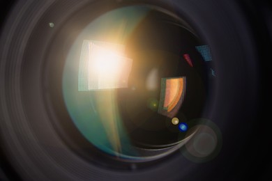 Image of Camera lens of professional photographer, closeup view