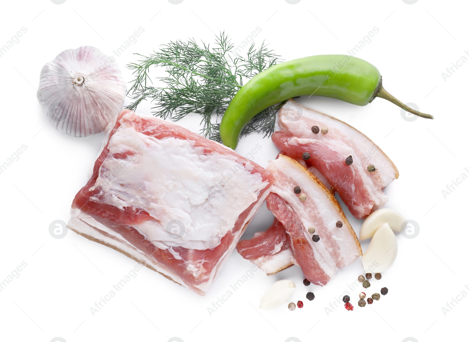 Photo of Pieces of pork fatback and different spices on white background, top view