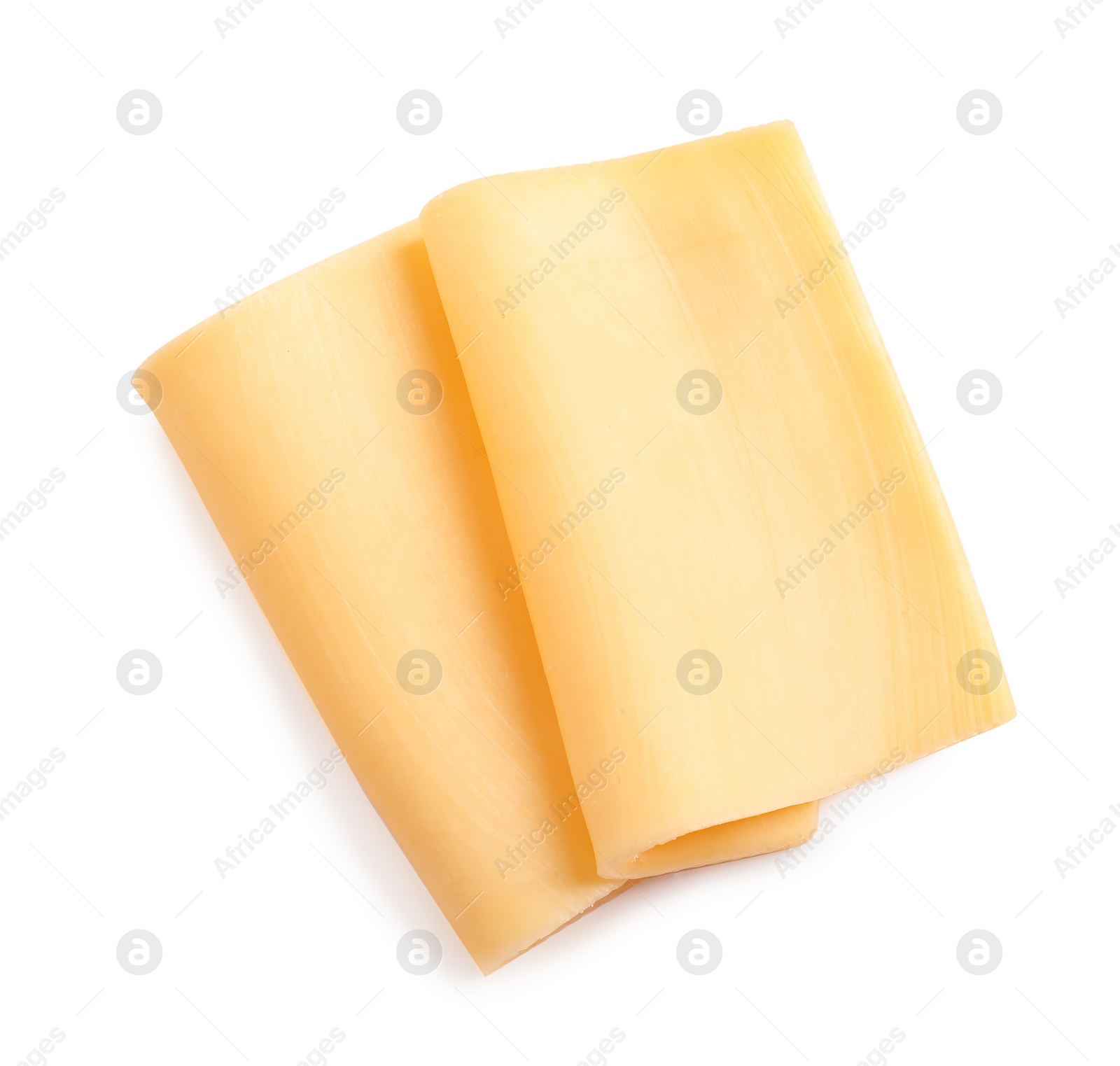 Photo of Slices of tasty cheese on white background, top view