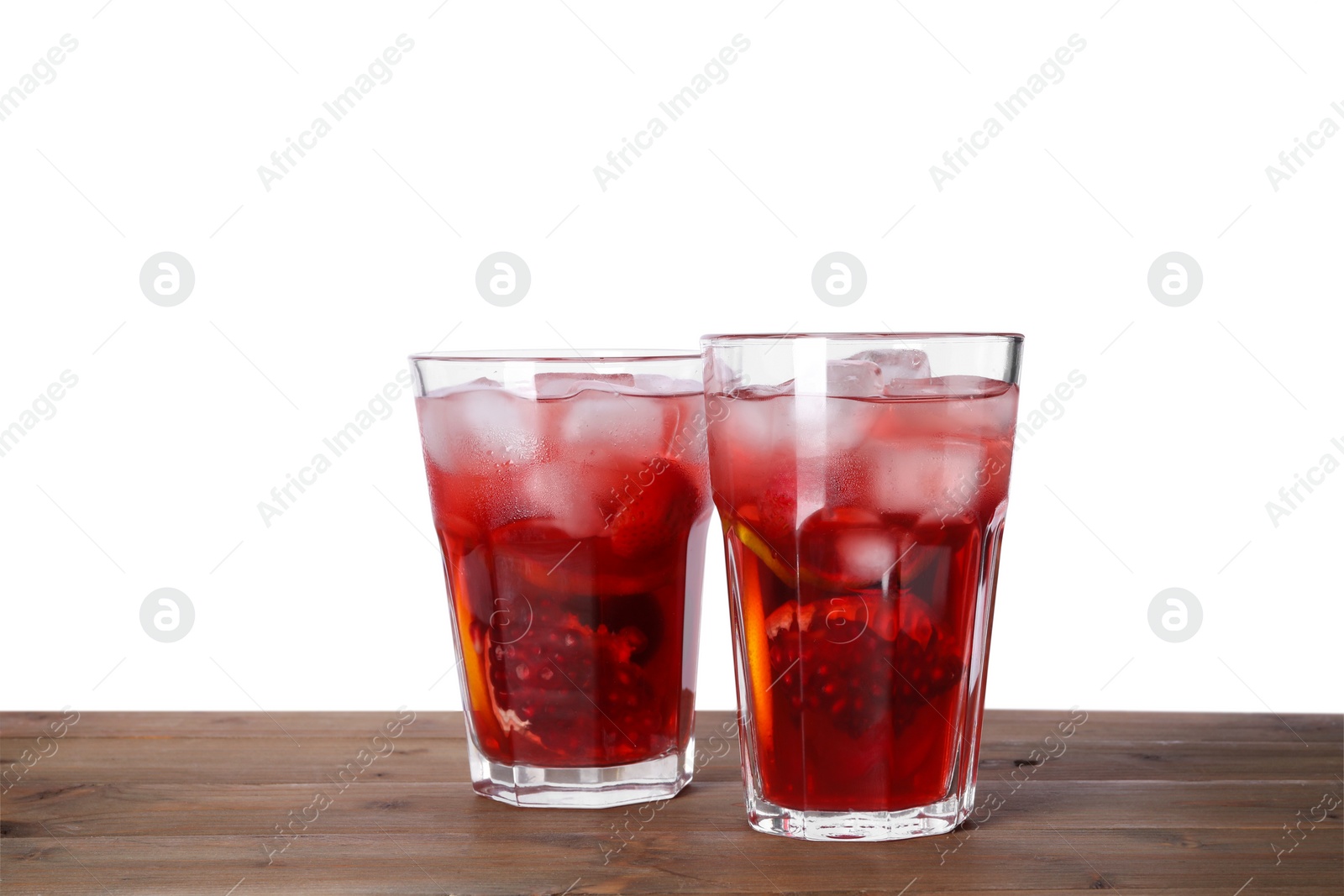 Photo of Delicious refreshing sangria on wooden table against white background