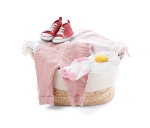 Photo of Laundry basket with baby clothes and shoes isolated on white