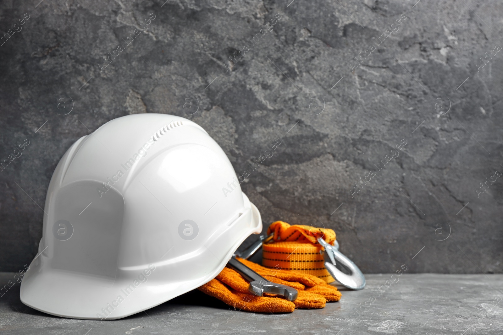 Photo of Composition with construction tools on grey table, space for text