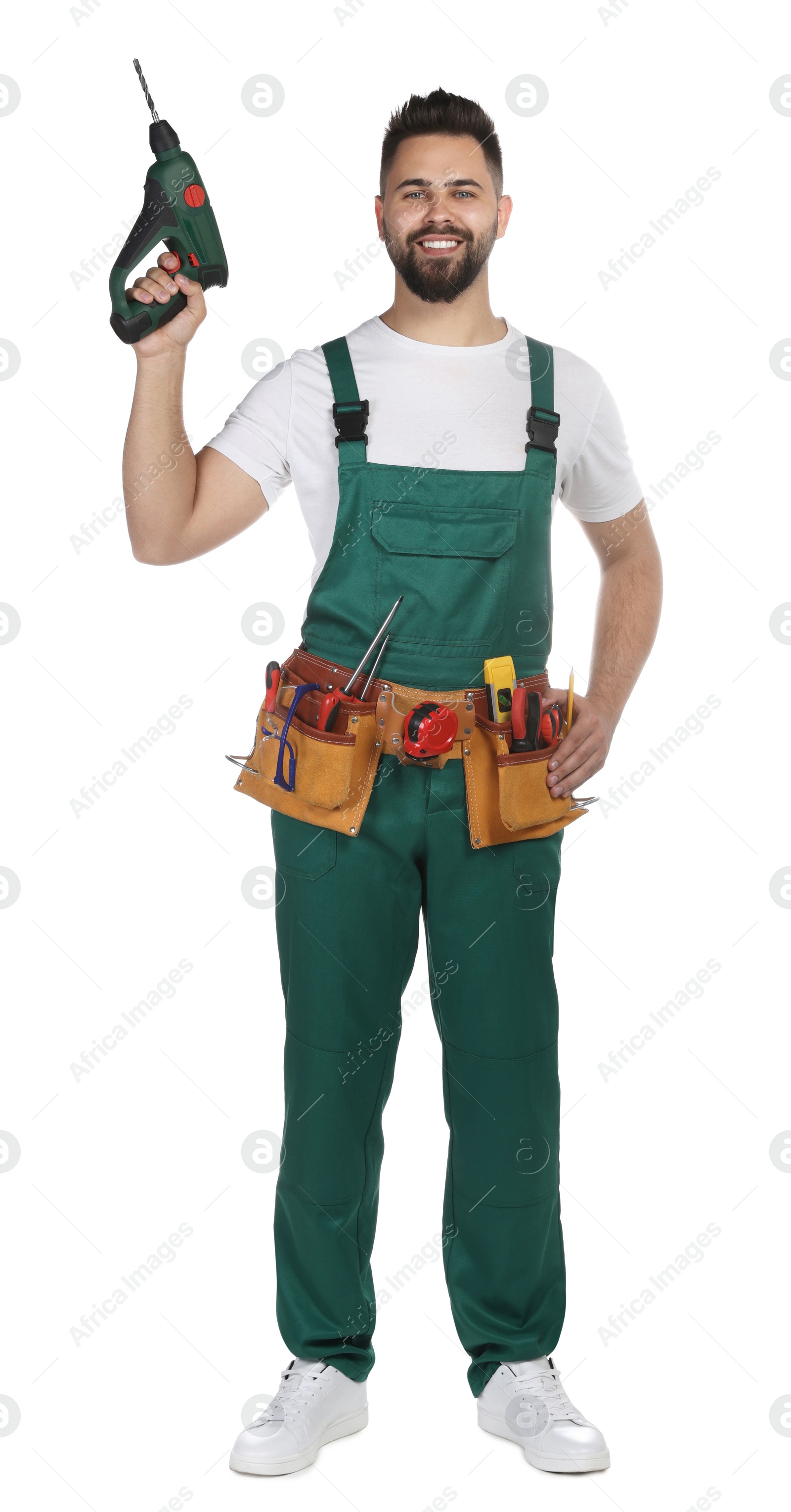 Photo of Young worker in uniform with power drill on white background