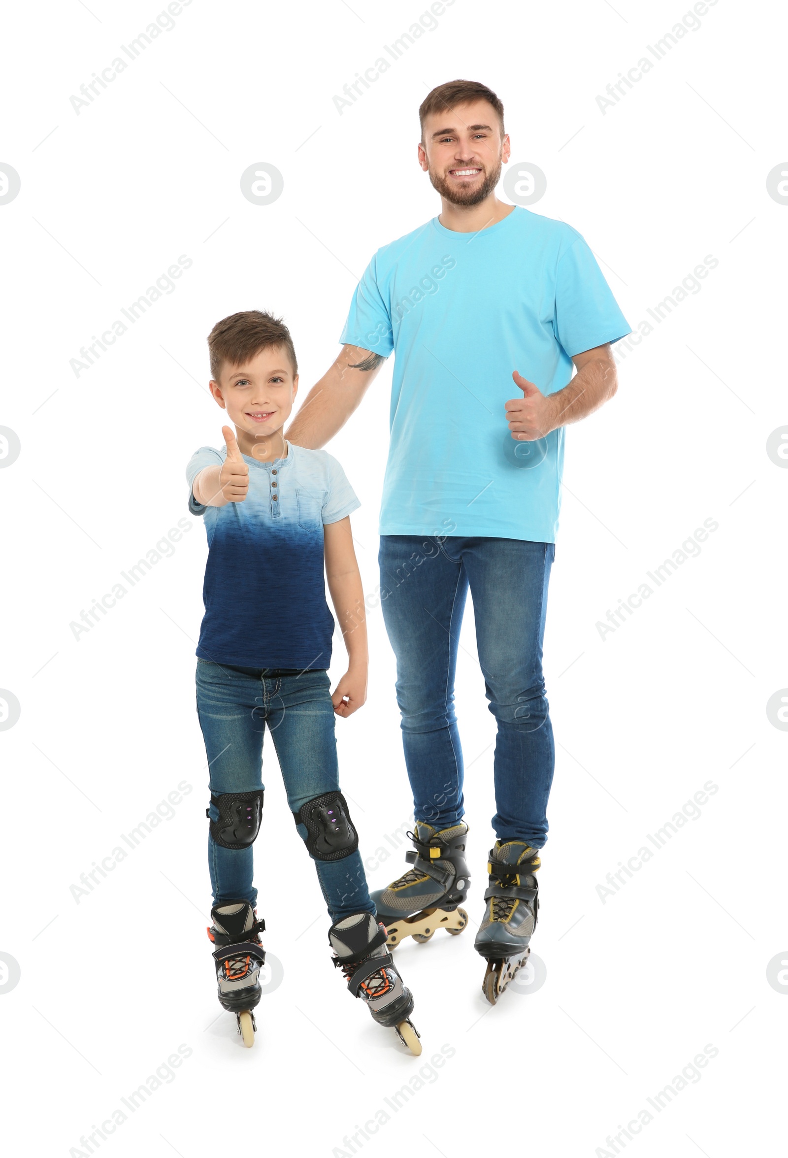 Photo of Father and son with roller skates on white background